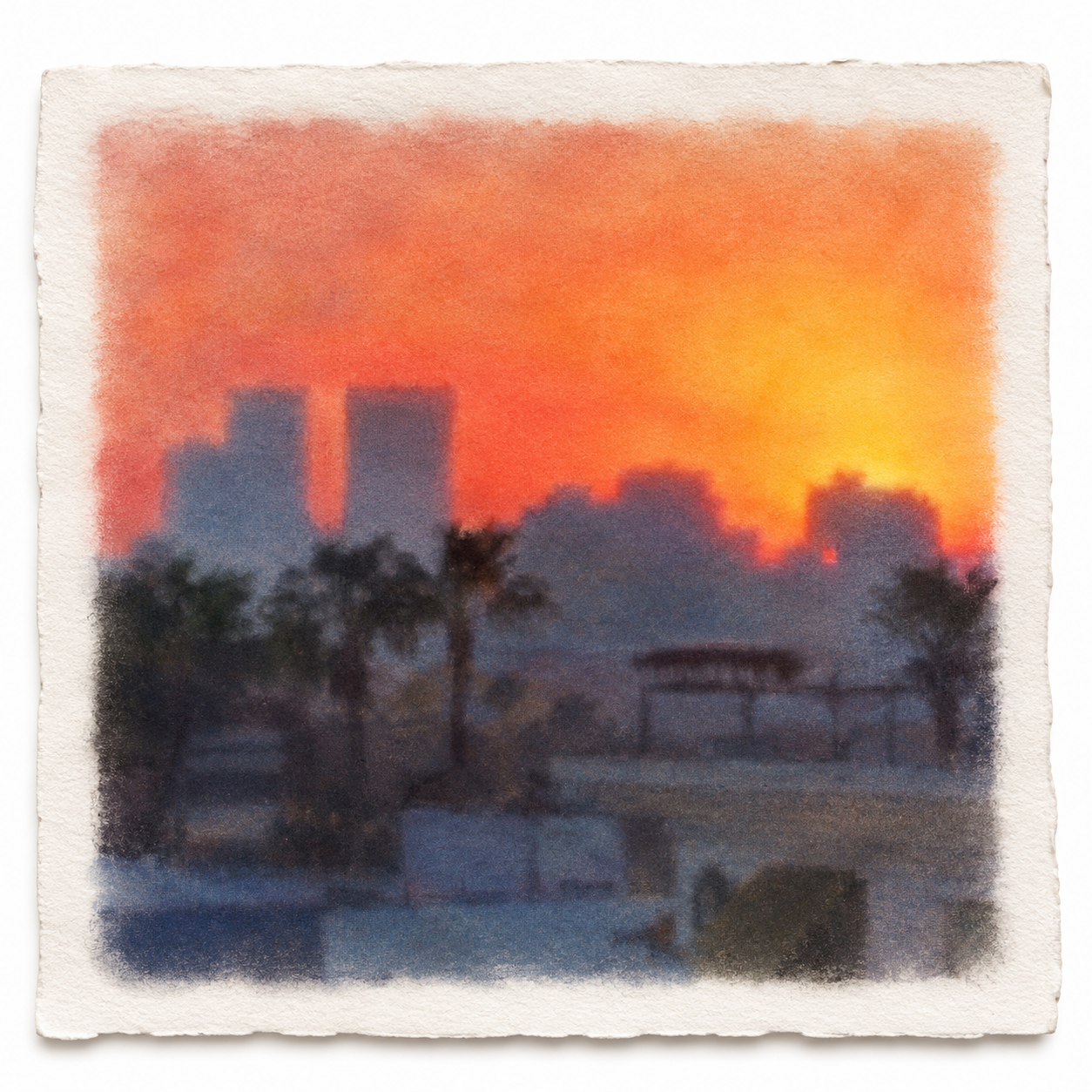 Los Angeles skyline and palm trees against an orange sunset